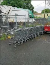  ?? PHOTO PROVIDED ?? More than 10 retailer’s shopping carts are seen here behind the city of Watervliet’s public works garage after city officials removed them from the streets.