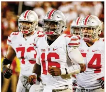  ?? SCOTT HALLERAN / GETTY IMAGES 2016 ?? Despite a 26-4 record as a starter, J.T. Barrett (center) isn’t universall­y admired by Ohio State fans — some blame him for last year’s 31-0 playoff loss to Clemson.