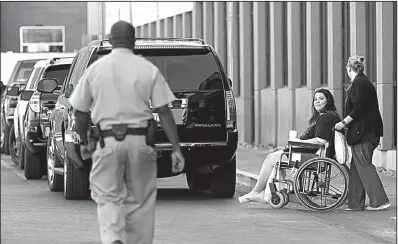  ?? AP/GREGORY BULL ?? Taylor Stovall, who was wounded in the Sunday mass shooting in Las Vegas, is wheeled out of University Medical Center on Tuesday.