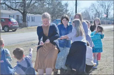  ?? (NWA Democrat-Gazette/Daniel Bereznicki) ?? Children engage in a game of tug-of-war Feb. 9 at New Bethel School in Anderson, Mo.