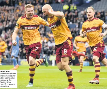  ??  ?? Well hero Motherwell’s Curtis Main wheels away after opening the scoring in the Scottish Cup semi-final against Aberdeen
