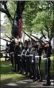  ?? PHOTO PROVIDED ?? Officials with the military shoot off their guns during a special ceremony Sunday in Green Island.