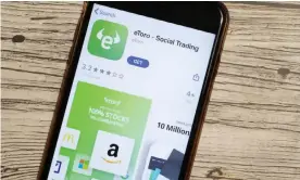  ??  ?? Apps such as eToro allow small investors to get involved in stock-market trading. Photograph: Postmodern Studio/Alamy