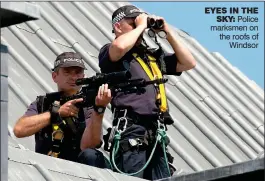  ??  ?? EYES IN THE SKY: Police marksmen on the roofs of Windsor