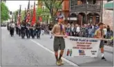  ??  ?? Boy Scouts prepared the crowd for the arrival of the flag at the Kennett Square Memorial Day parade.