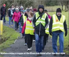  ??  ?? Walkers enjoy a cuppa at the Riverside Hotel after the 4km walk