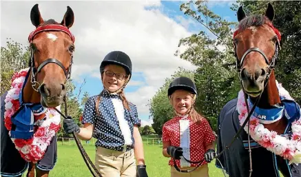  ??  ?? Amelia and Imogen Malcolm-Solly with their ponies Mia and Kingston.