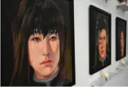  ??  ?? Oil portraits of deceased anime characters.