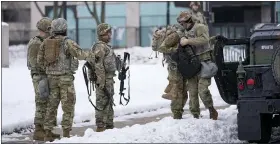  ?? MORRY GASH — THE ASSOCIATED PRESS ?? National guard members stage outside a museum Tuesday, in Kenosha, Wis.