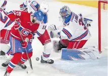  ?? JOHN MAHONEY ?? Canadiens forward Alex Galchenyuk battles for a loose puck in front of Henrik Lundqvist during the second period Wednesday. One big problem was a failure to capitalize on second chances.