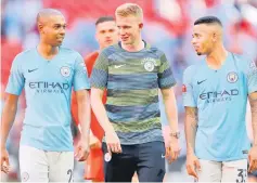  ?? — Reuters photo ?? (From left) Manchester City’s Fernandinh­o, Kevin De Bruyne and Gabriel Jesus react after winning the community shield in this Aug 5 file photo.
