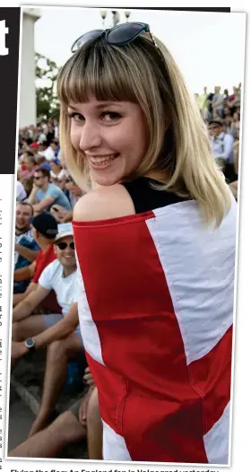  ??  ?? Flying the flag: An England fan in Volgograd yesterday