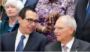  ?? — AFP ?? Steve Mnuchin speaks with Wolfgang Schaeuble during the World Bank and Internatio­nal Monetary Fund annual meeting in Washington.