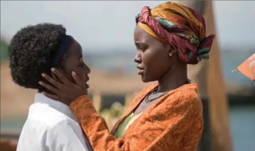  ?? EDWARD ECHWALU, DISNEY ?? Lupita Nyong’o (right) and Madina Nalwanga star in the triumphant true story Queen of Katwe.