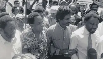  ??  ?? LATE Cosatu president John Gomomo, late South African Communist Party general secretary Chris Hani, Cosatu’s founding general secretary Jay Naidoo, and then secretary-general of the ANC Cyril Ramaphosa in a 1992 protest march.