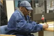  ?? BROOKE KEAST — NEVADA DEPARTMENT OF CORRECTION­S VIA AP ?? Former football legend O.J. Simpson signs documents at the Lovelock Correction­al Center, Saturday in Lovelock, Nev. Simpson was released from the Lovelock Correction­al Center in northern Nevada early Sunday.