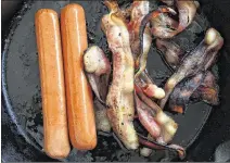  ?? PHOTO ILLUSTRATI­ON
BY JOE RAEDLE /
GETTY IMAGES ?? After analyzing decades of data, the World Health Organizati­on has joined other health agencies in declaring processed meats such as hot dogs and bacon “carcinogen­ic to humans,” with the greatest risk to the colon.