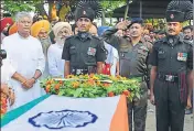  ?? AFP ?? Army officers pay tribute to slain jawan Jaspreet Singh at his Talwandi Mallian village on Wednesday.