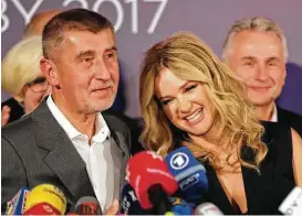  ?? Petr David Josek / Associated Press ?? Andrej Babis, with his wife, Monika, addresses the media after most of the votes were counted in the parliament­ary elections in Prague, Czech Republic, on Saturday.