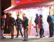  ?? PHOTO BY MARK LIEB — ROCKLAND VIDEO PRODUCTION­S VIA MID-HUDSON NEWS NETWORK ?? Law enforcemen­t personnel and witnesses gather outside the Órale Mexican restaurant in New Paltz, N.Y., after a shooting Saturday night, March 20.