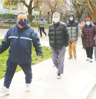 ?? NICK PROCAYLO ?? Seniors are escorted to their vaccinatio­n appointmen­ts in Vancouver on Tuesday. Vancouver Coastal Health says it is committed to finding community partners to aid in transporta­tion to sites.