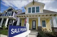  ?? (AP) ?? A “sale pending” sign is posted outside a house in Westfield, Ind., in this September photo. Sales of previously owned homes climbed 9.4% in September, the National Associatio­n of Realtors said Thursday.