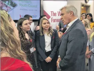  ?? ASHLEY FITZPATRIC­K/THE TELEGRAM ?? Premier Dwight Ball speaks to members of the Premier’s Youth Council at the Confederat­ion Building in St. John’s on Friday afternoon, after a press conference with questions on the full day of meetings involving the council, premier and provincial ministers.