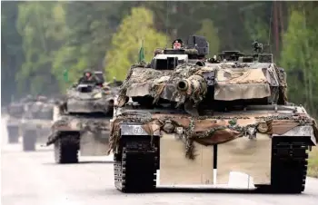 ?? AFP ?? This file photo shows German soldiers on Lepard tanks arriving for a friendship shooting of several nations during the exercise at the military training area in Grafenwoeh­r, near Eschenbach, southern Germany. —