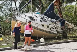  ??  ?? High and dry: A private yacht is left on a walkway in Miami