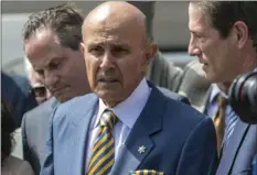  ??  ?? Former Los Angeles County Sheriff Lee Baca (center) talks to the media surrounded by his attorneys outside federal court Friday in Los Angeles Friday. AP PHOTO