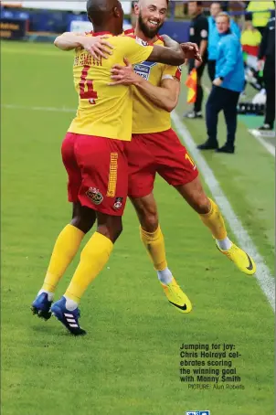  ?? PICTURE: Alun Roberts ?? Jumping for joy: Chris Holroyd celebrates scoring the winning goal with Manny Smith