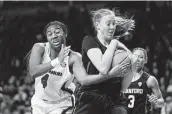  ?? Sean Rayford / Associated Press ?? South Carolina’s Aliyah Boston, left, and Stanford’s Ashten Prechtel battle during Tuesday’s 1-2 matchup.