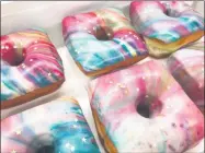  ?? PHOTO PROVIDED ?? Brioche yeast-raised doughnuts by Darling Doughnuts are colorfully decorated.