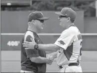  ?? NWA Democrat-Gazette/BEN GOFF ?? LSU Coach Paul Mainieri (left) and Arkansas Coach Dave Van Horn will get a chance to stay at home this week after their respective teams were selected as regional hosts for the NCAA Division I baseball tournament.