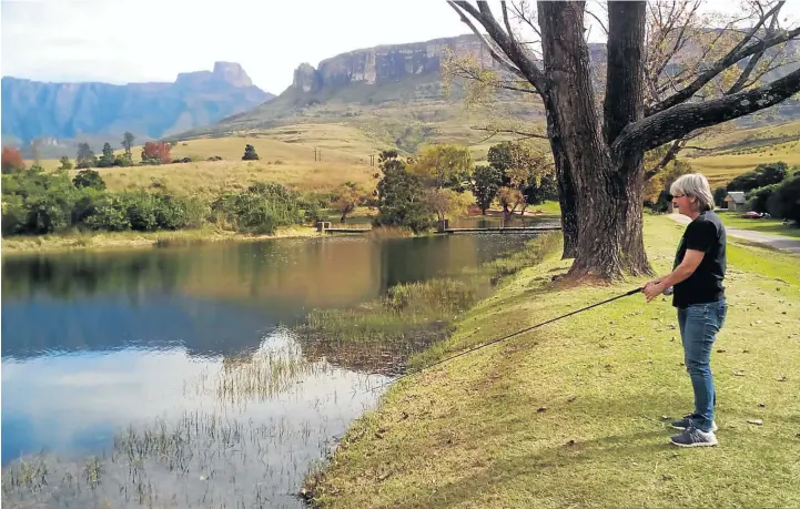  ?? HELEN SMITH ?? Brenda Robinson fishing in the Royal Natal National Park, above; and below, the Airbnb caravan