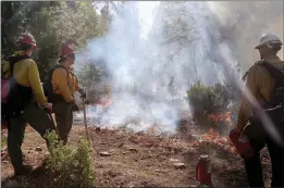  ?? Guy Mccarthy / Union Democrat ?? Firefighte­rs began a test burn about 9:30 a.m.tuesday and continued with ignitions 45 minutes later, just below the 4,845-foot summit of Mount Provo, betweentwa­in Harte, Ponderosa Hills andtuolumn­e township. Burn bosses, fuels management officers, and other Stanislaus National Forest staff said weather forecasts were favorable to proceed with conducting prescribed fire operations on Mount Provo.