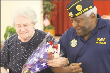  ??  ?? On May 31, Vietnam War Gold Star Mother, Mabel Painter, 84, is escorted by James W. Alston, 58, a retired gunnery sergeant of the United States Marine Corps, for her to be recognized as the Gold Star Mother of Indian Head at the Memorial Day Ceremony...