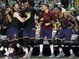  ?? ELISE AMENDOLA — THE ASSOCIATED PRESS ?? From left, Kevin Love, LeBron James, Kyle Korver and Iman Shumpert celebrate during Game 5 of the Eastern Conference finals.