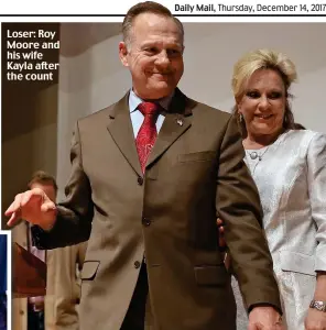  ??  ?? Loser: Roy Moore and his wife Kayla after the count