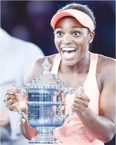  ??  ?? Sloane Stephens of the US reacts with winning trophy after defeating compatriot Madison Keys in their 2017 US Open Women’s Singles final match at the USTA Billie Jean King National Tennis Center in New York on September 9, 2017. Sloane Stephens,...