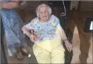  ?? SUBMITTED PHOTO - MICHAEL MCHENRY ?? Ella McHenry greets family for her 100th birthday. Family visited from the other side of a window at Zerbe Sisters retirement community in Narvon on June 5.