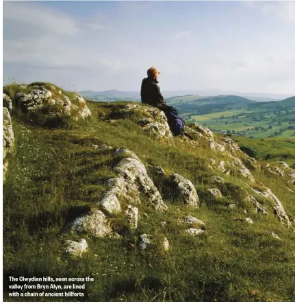  ??  ?? The Clwydian hills, seen across the valley from Bryn Alyn, are lined with a chain of ancient hillforts