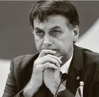  ?? Pedro Ladeira/folhapress ?? O presidente eleito Jair Bolsonaro durante reunião com governador­es ontem; não falou de denúncias