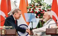  ?? - PTI ?? ELATED: Prime Minister Narendra Modi shakes hands with Turkish President Recep Tayyip Erdogan after their joint statement at Hyderabad House in New Delhi on Monday.