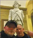  ?? COURTESY UNITED STATES CAPITOL POLICE ?? Rocky
Mount Police Department Sgt. Thomas “T.J.” Robertson and officer Jacob Fracker in the U.S. Capitol in front of a statute of John Stark.