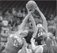  ?? Arkansas Democrat-Gazette/STATON BREIDENTHA­L ?? East All-Star Kennedy Cooper (right) of Izard County and West All-Star Keke Hunter (left) of Hot Springs fight for a rebound during the Arkansas High School Coaches Associatio­n All-Star girls basketball game Thursday night at the Farris Center in...