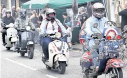  ??  ?? Mods paraded through town on their scooters