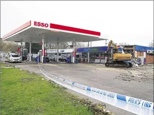  ?? ?? The damage caused at an Esso garage in Staplehurs­t, after a digger was used to rip away the cash machine during the incident in January 2020, also pictured below. Two men have now been charged and appeared in court alleged with carrying out the raid along with others across Kent