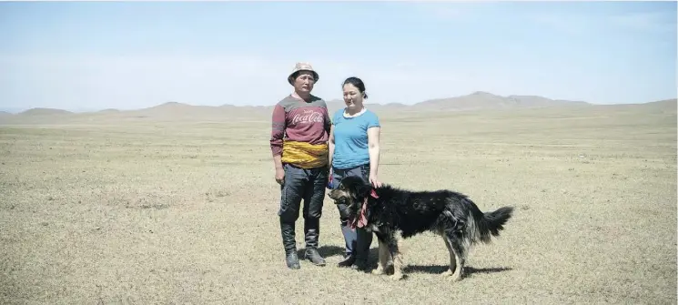  ?? PHOTOS: GIULIA MARCHI ?? There are few incentives for herders like Banzragch Batbold and his wife, Altantuya, to remain in the remote communitie­s of their native Mongolia.