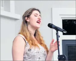  ?? Photo / Bethany Rolston ?? Former Te Awamutu College student Katie Trigg performs outside the Cambridge Town Hall on Sunday for the start of week-long commemorat­ions for the Armistice Day Centenary.